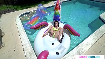 Petite Riley Jean toys pussy in the pool